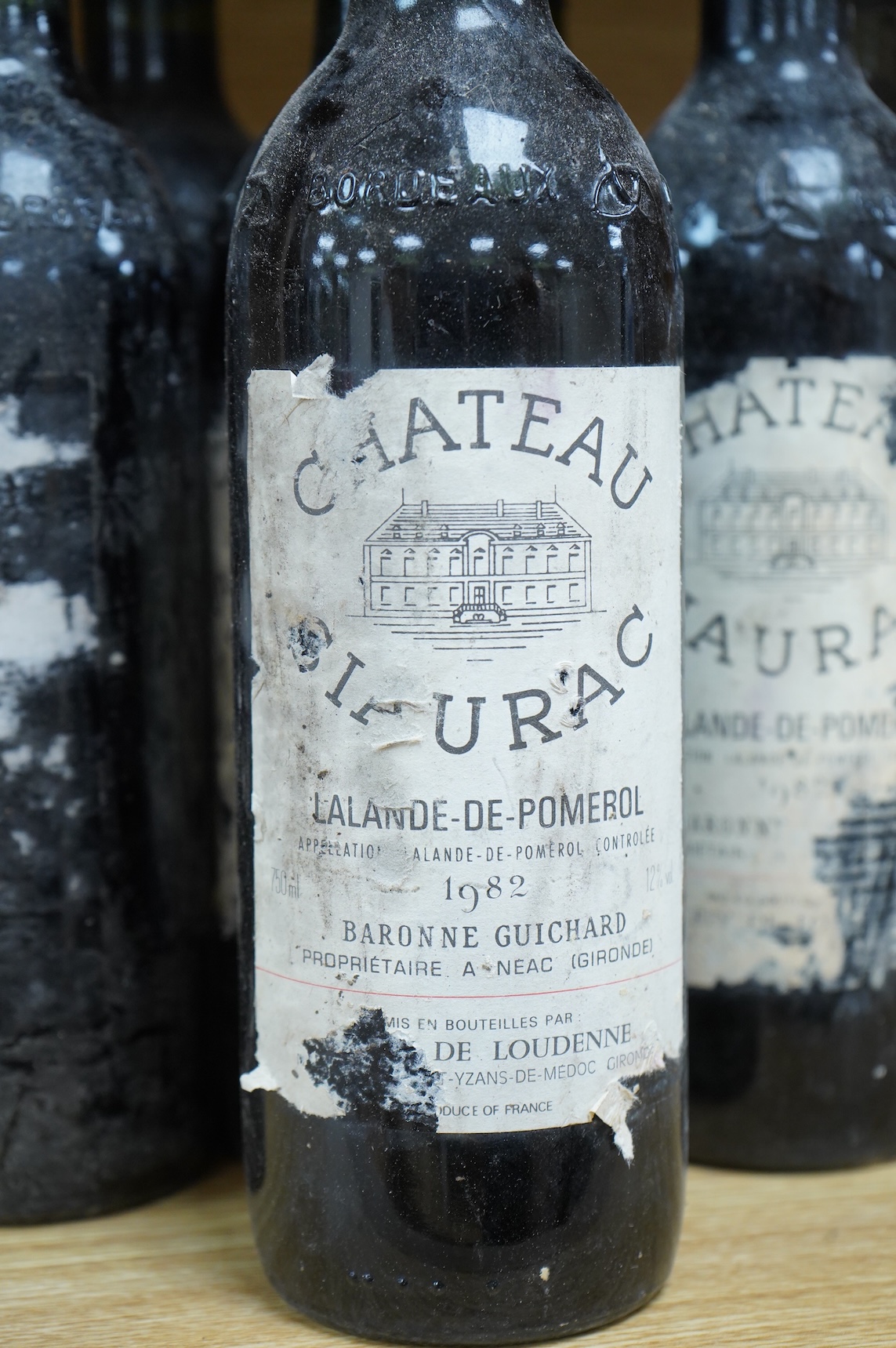 Eight bottles of Chateau Siaurac 1982, labels defective